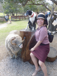 Miaomiao with sheep and dog during the Sheep Shearing Show at the Lone Pine Koala Sanctuary