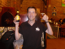 Tim with an XXXX Gold beer at the Pancake Manor restaurant at Charlotte Street