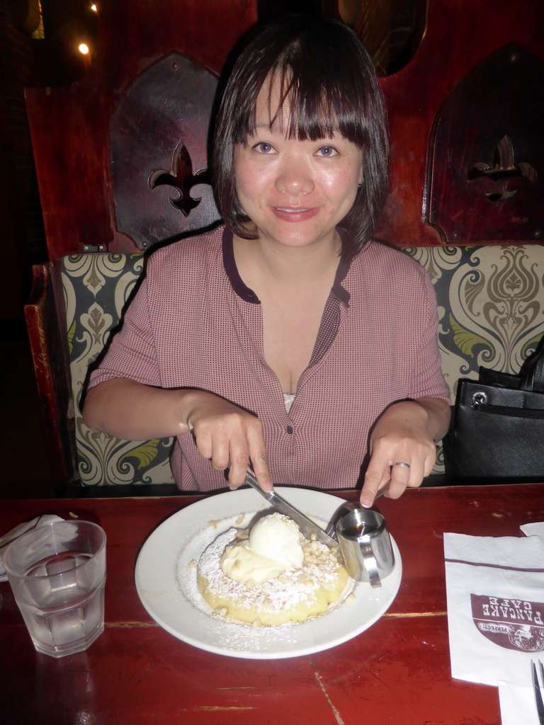 Miaomiao eating a pancake at the Pancake Manor restaurant at Charlotte Street