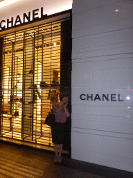 Miaomiao in front of the Chanel store at Queen Street, by night