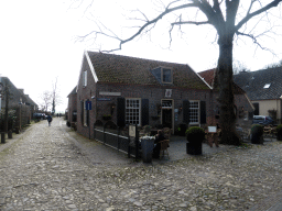 Front of the Het Wapen van Bronkhorst restaurant at the Gysbertplein 1344, and the Boterstraat street