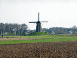 Farmland and the Bronkhorster Molen windmill, viewed from the bridge over the Groote Beek stream at the Bekerwaardseweg street