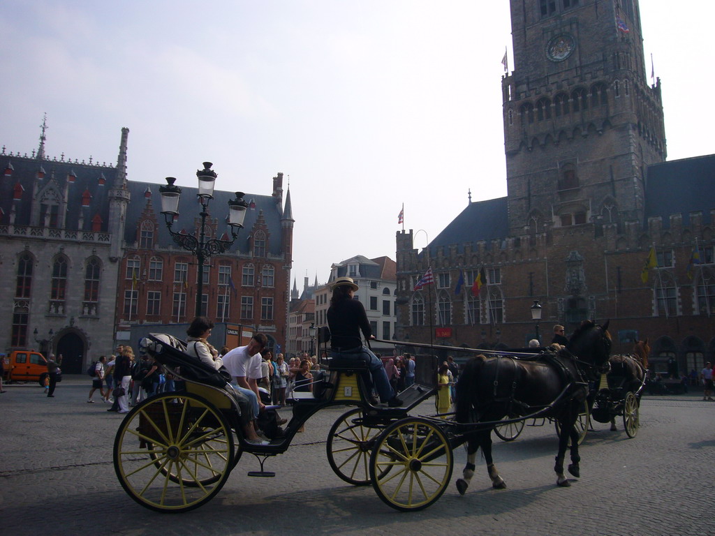 Horses and carriages at the Markt square, with the right front of the Provincial Court and the front of the Belfort tower