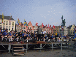 Youth orchestra at the Markt square, with restaurants and the Statue of Jan Breydel and Pieter de Coninck