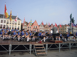 Youth orchestra at the Markt square, with restaurants and the Statue of Jan Breydel and Pieter de Coninck
