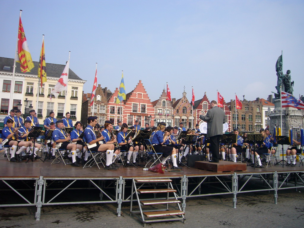 Youth orchestra at the Markt square, with restaurants and the Statue of Jan Breydel and Pieter de Coninck