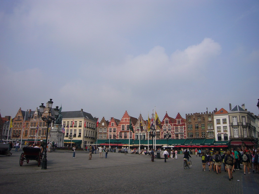 The Markt square with horse and carriage, restaurants and the Statue of Jan Breydel and Pieter de Coninck