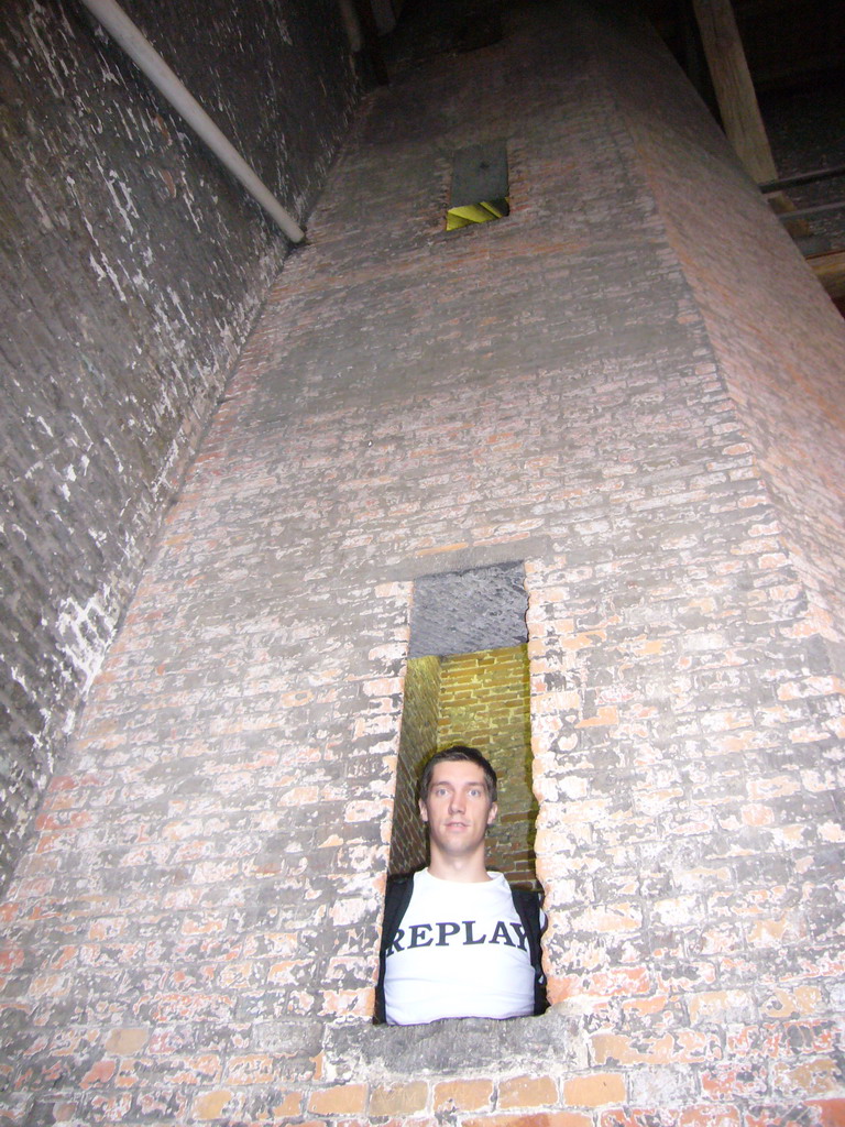 Tim in a window at the upper part of the Belfort tower