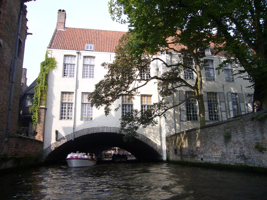 The Arentshuis building and boats on the Bakkersrei canal, viewed from the tour boat