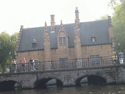 Bridge over the Bakkersrei canal and the south side of the Sashuis building at the Begijnenvest street, viewed from the tour boat