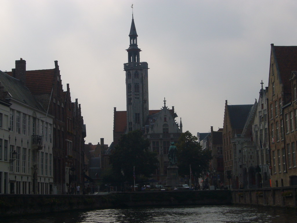The Jan van Eyckplein square with the statue of Jan van Eyck and the Burghers` Lodge, viewed from the tour boat on the Spinolarei canal