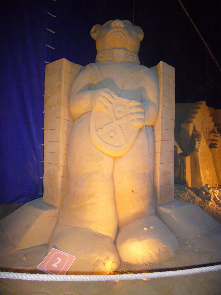 Sand sculpture of a bear with a coat of arms, at the Sand Sculpture Festival at the Stationspark