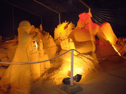 Sand sculpture of a woman and a dragon, at the Sand Sculpture Festival at the Stationspark