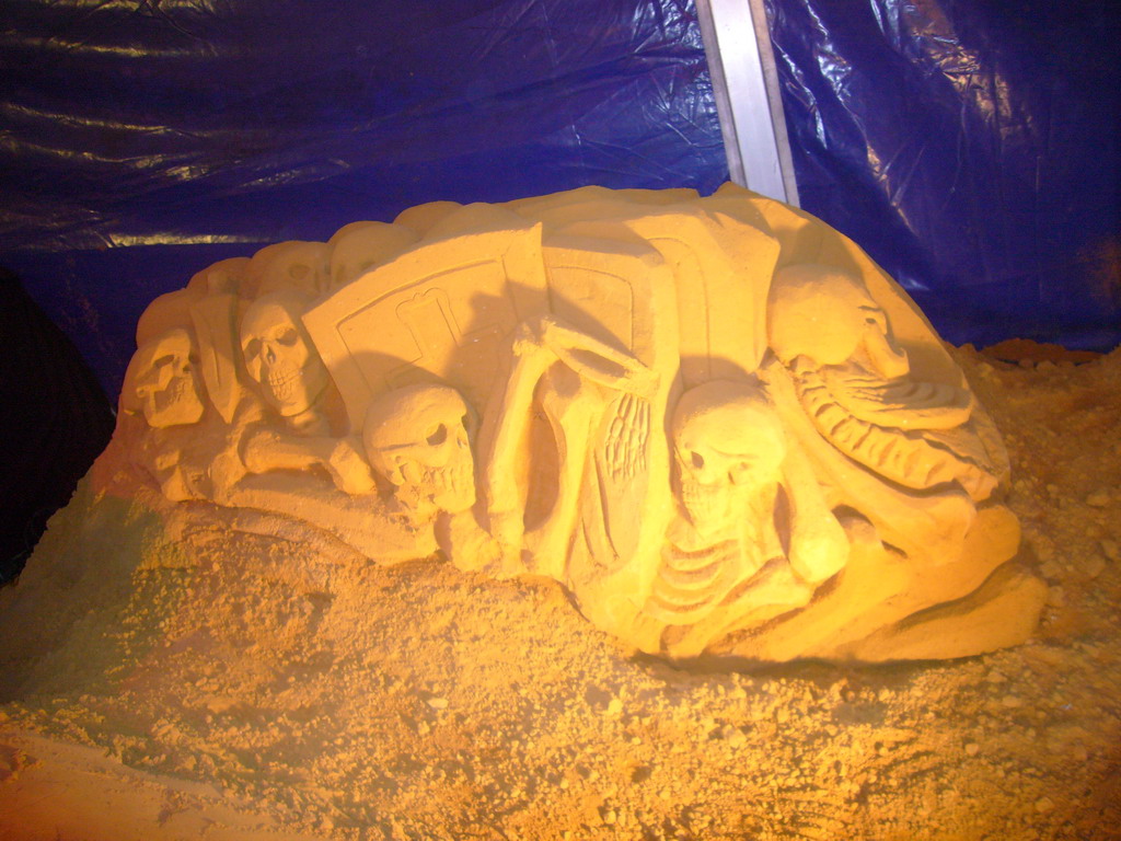 Sand sculpture of skeletons and shields, at the Sand Sculpture Festival at the Stationspark