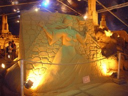 Sand sculptures of a relief of a woman, the St. Salvator`s Cathedral and the Belfort tower, at the Sand Sculpture Festival at the Stationspark