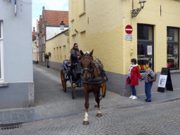 Miaomiao, Miaomiao`s mother and horse and carriage at the crossing of the Groeninge street and the Nieuwe Gentweg street