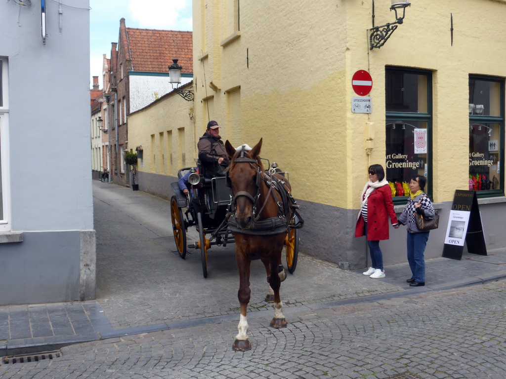 Miaomiao, Miaomiao`s mother and horse and carriage at the crossing of the Groeninge street and the Nieuwe Gentweg street