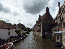 Boats at the west side of the Bakkersrei canal and the south side of the Oud Sint-Janshospitaal museum, viewed from the Mariastraat bridge