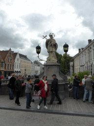 Miaomiao and her parents in front of the Statue of Saint John of Nepomuk, at the Nepomucenusbrug bridge over the Dijver canal