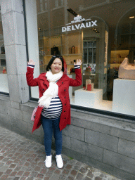 Miaomiao in front of the Delvaux shop at the Breidelstraat street
