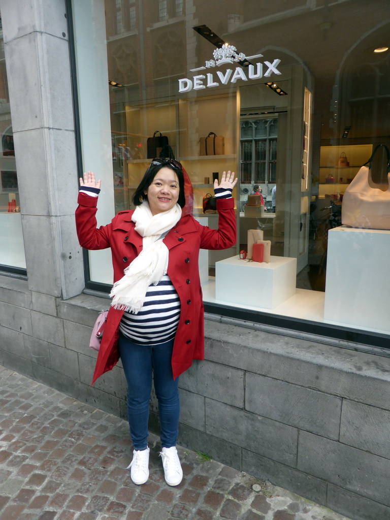 Miaomiao in front of the Delvaux shop at the Breidelstraat street