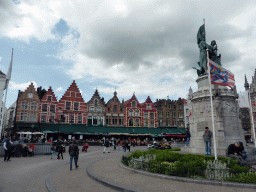 The north side of the Markt square with restaurants and the Statue of Jan Breydel and Pieter de Coninck