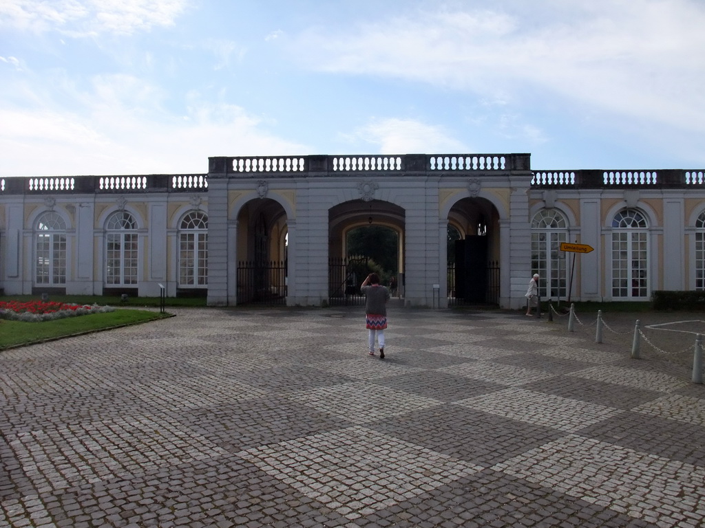 Miaomiao in front of the gate to the gardens of the Augustusburg Palace