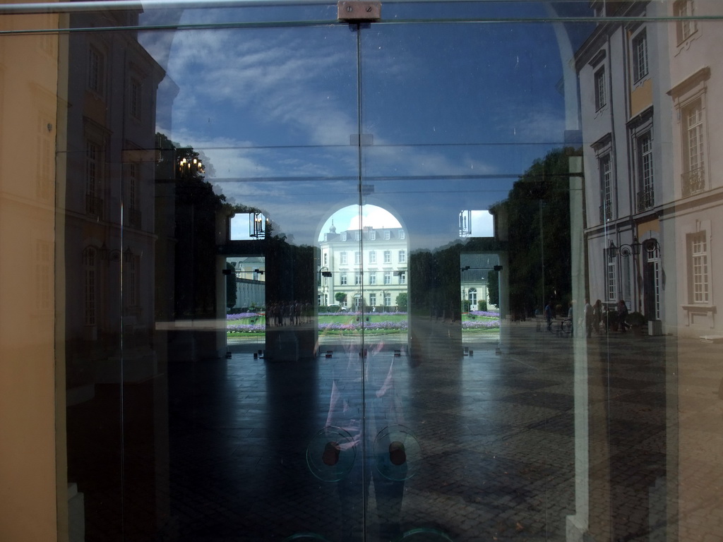 Glass door at the front of the Augustusburg Palace, with a view on the central hall and the gardens on the back side
