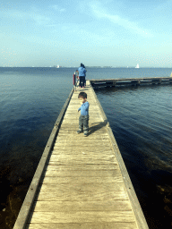 Max and people catching crabs on a pier at the northwest side of the Grevelingendam