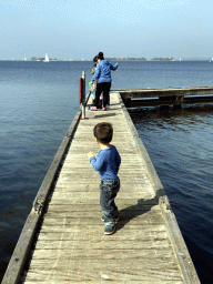 Max and people catching crabs on a pier at the northwest side of the Grevelingendam