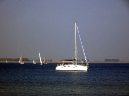 Sailboat at the Grevelingenmeer lake, viewed from the northwest side of the Grevelingendam