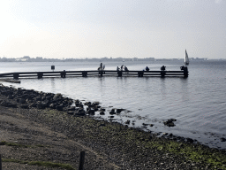 People catching crabs on a pier at the northwest side of the Grevelingendam