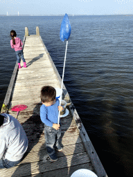 Max and other people catching crabs on a pier at the northwest side of the Grevelingendam