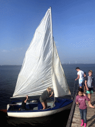 Sailboat at the Grevelingenmeer lake, viewed from a pier at the northwest side of the Grevelingendam