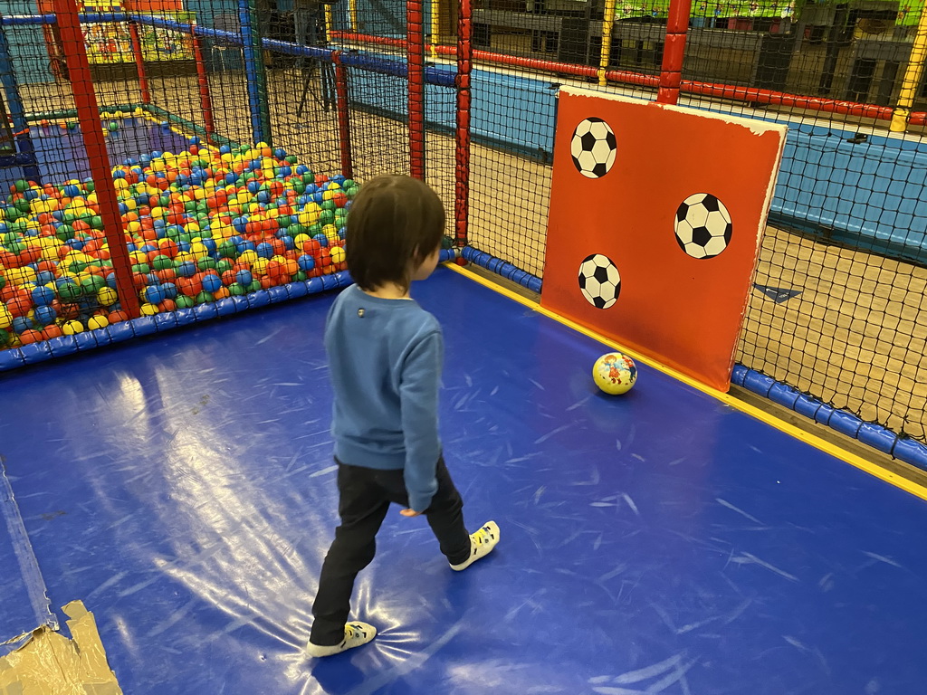 Max playing football at the Kinderland playground at Holiday Park AquaDelta