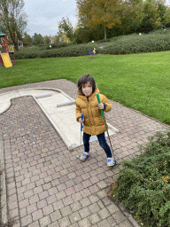 Max playing minigolf at the minigolf court of Holiday Park AquaDelta