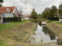 Holiday homes and a creek at Holiday Park AquaDelta