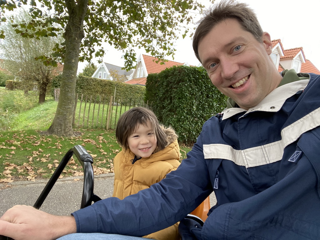 Tim and Max on a tricycle at Holiday Park AquaDelta