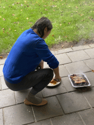 Miaomiao cooking on a barbecue in front of our apartment at Holiday Park AquaDelta