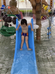 Max on the slide at the children`s pool at the swimming pool at Holiday Park AquaDelta