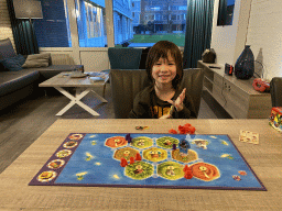 Max playing Catan Junior at the living room at the ground floor of our apartment at Holiday Park AquaDelta