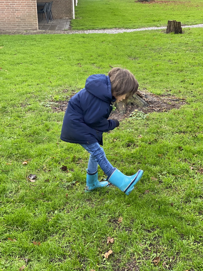 Max playing football at a grassland at Holiday Park AquaDelta