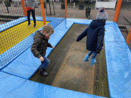 Max and his friend on the trampoline at the playground at the central square of Holiday Park AquaDelta