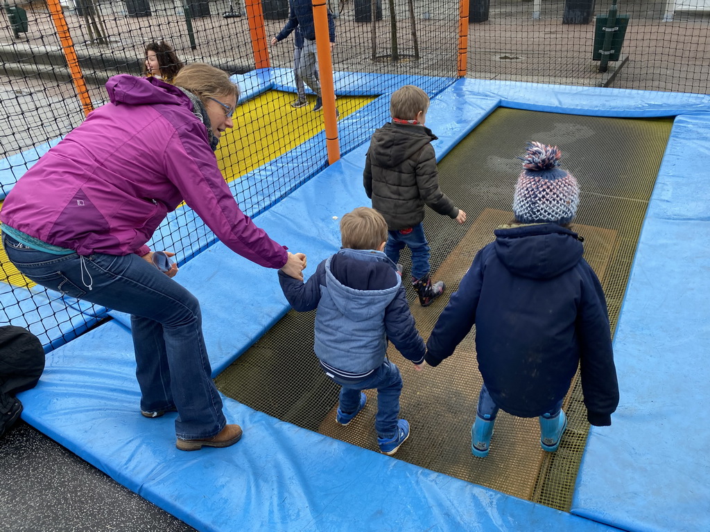 Max and his friends on the trampoline at the playground at the central square of Holiday Park AquaDelta