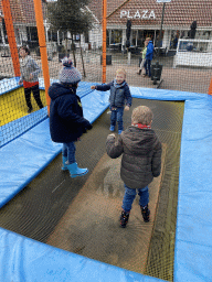 Max and his friends on the trampoline at the playground at the central square of Holiday Park AquaDelta