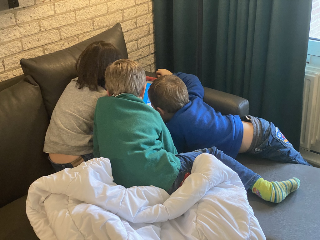 Max and his friends playing with iPad at the living room at the ground floor of our apartment at Holiday Park AquaDelta