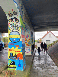 Miaomiao, Max and our friends with graffiti at the tunnel at the Noorddijk street
