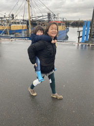 Miaomiao and Max with boats in the Harbour of Bruinisse