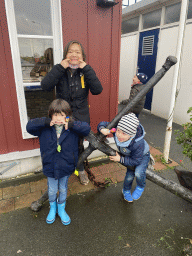 Miaomiao, Max and our friends with an anchor in front of the Bru 17 store at the Havenkade street