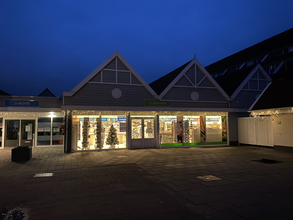 Front of the supermarket at the central square of Holiday Park AquaDelta, at sunrise